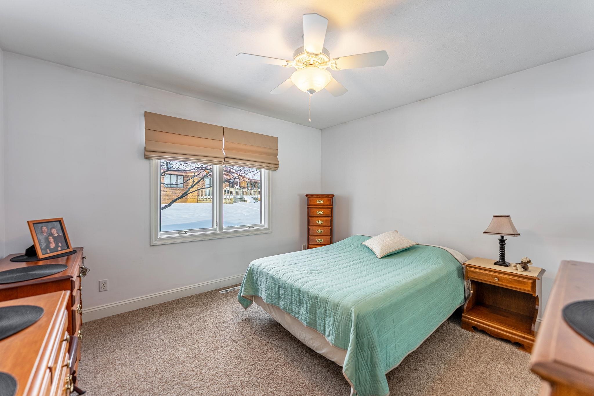 225 Secretariat's Way Belvidere, IL 61008 - Photo 21 of 41 a bedroom with a bed and a window