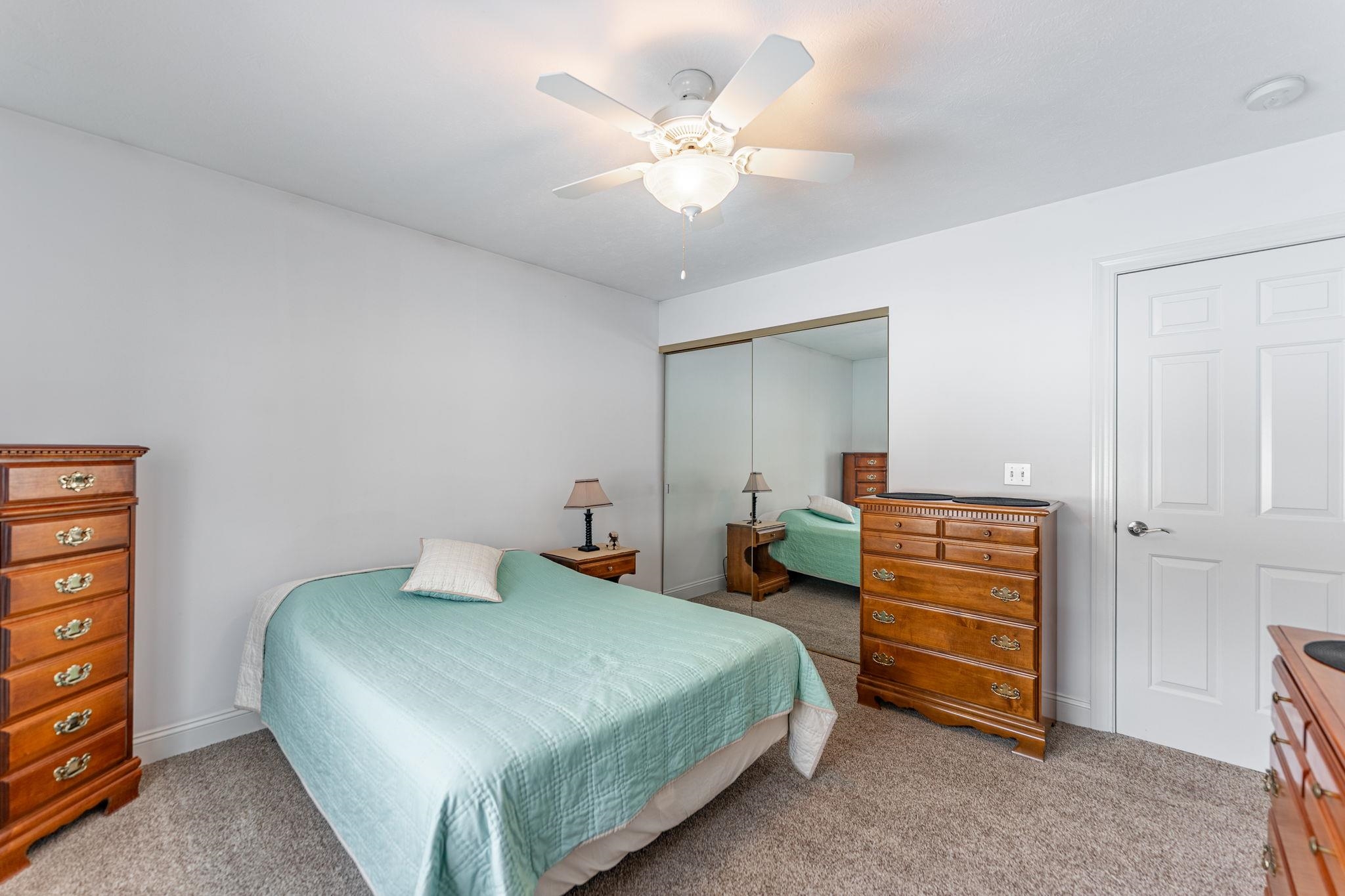 225 Secretariat's Way Belvidere, IL 61008 - Photo 22 of 41 a bedroom with a bed and a chandelier