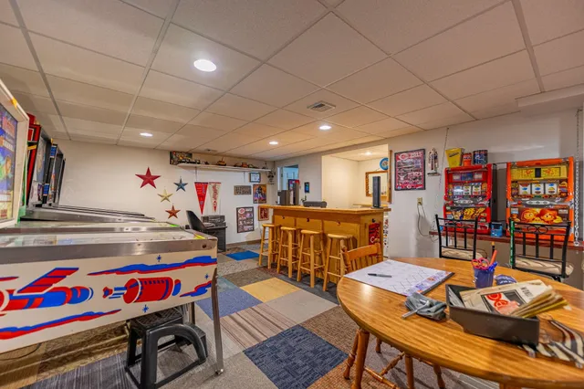 a view of a play room with furniture