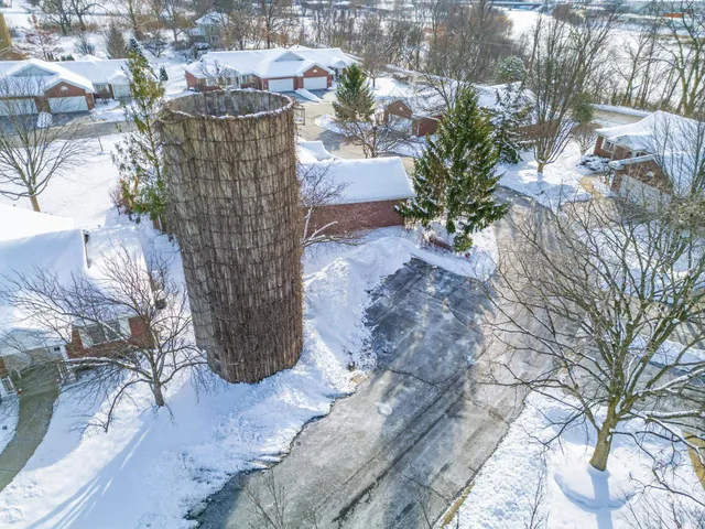 an aerial view of residential houses with outdoor space