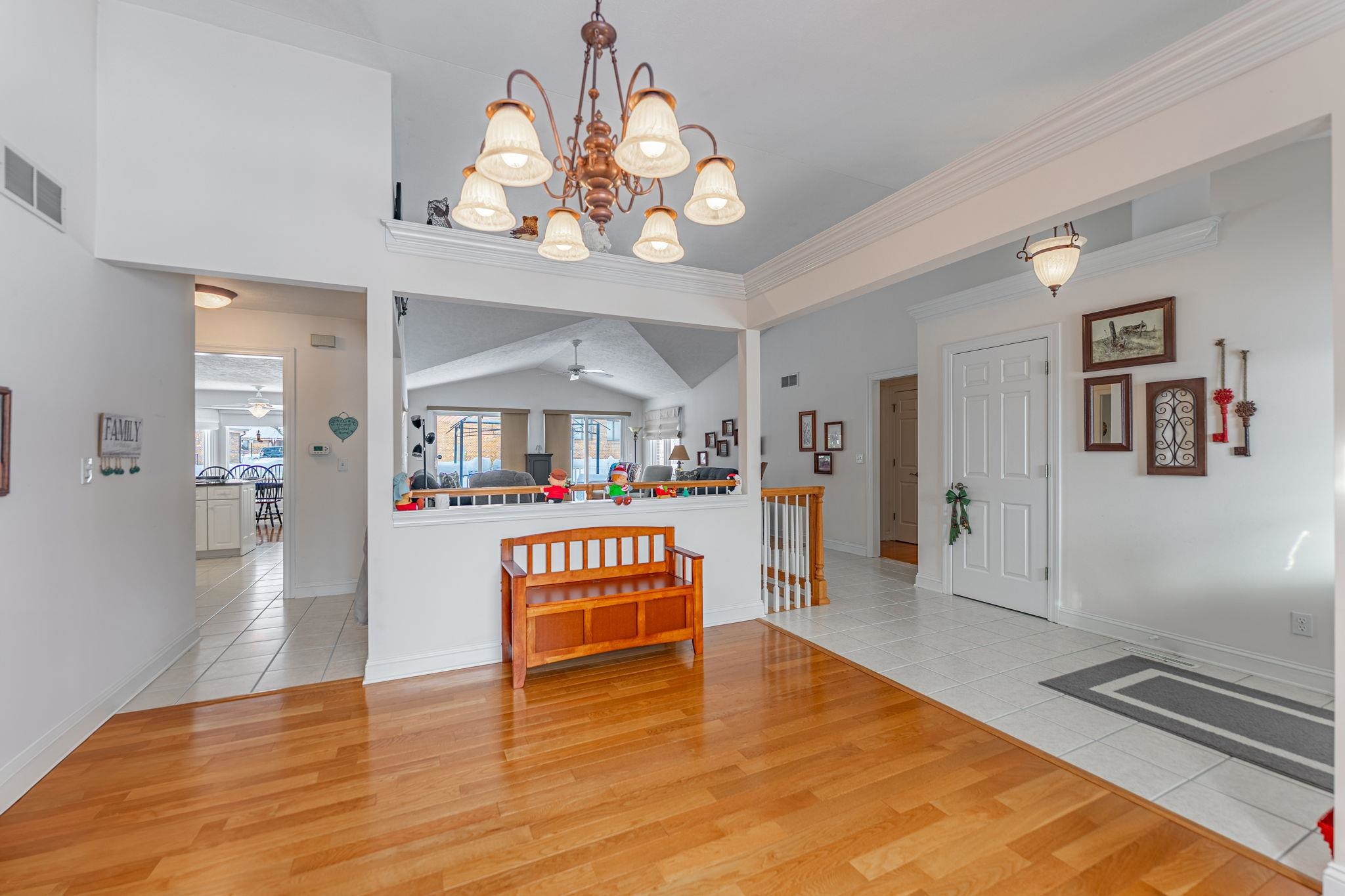 225 Secretariat's Way Belvidere, IL 61008 - Photo 6 of 41 a view of a room with wooden floor and chandelier