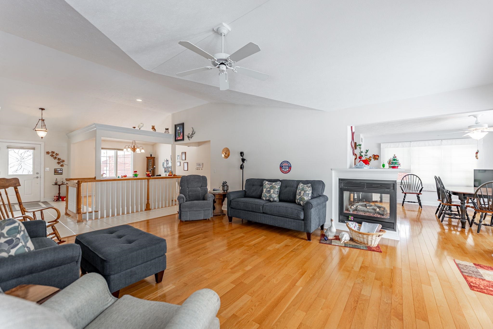 225 Secretariat's Way Belvidere, IL 61008 - Photo 8 of 41 a living room with furniture and wooden floor