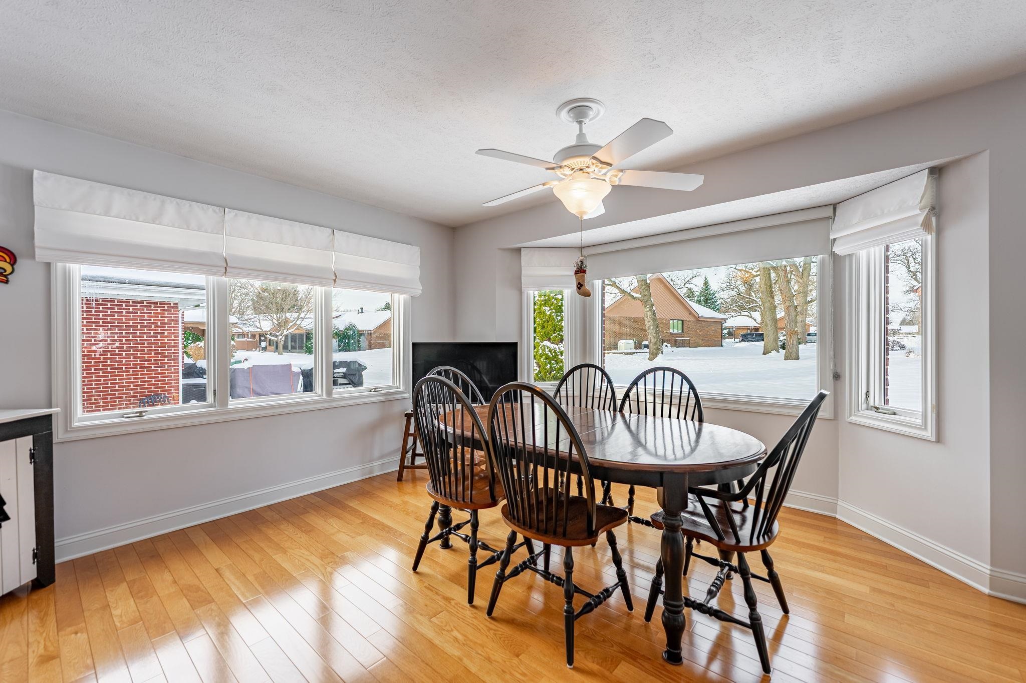 225 Secretariat's Way Belvidere, IL 61008 - Photo 10 of 41 a dining room with furniture a chandelier and wooden floor