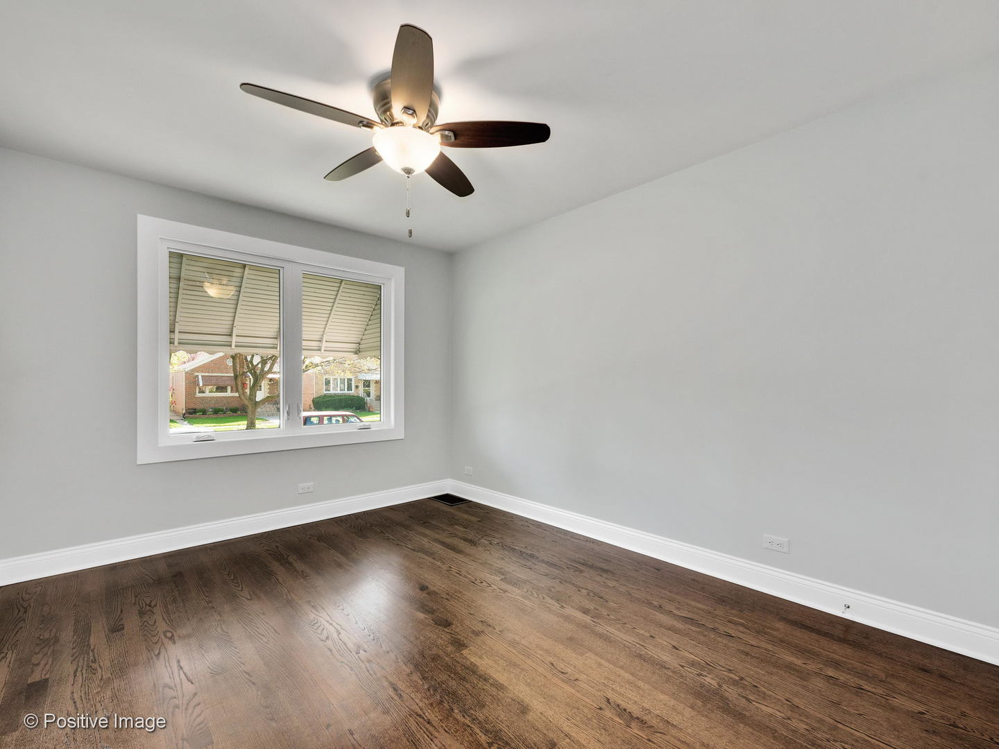 2232 Forest Avenue North Riverside, IL 60546 - Photo 4 of 17 a view of an empty room with wooden floor and a window
