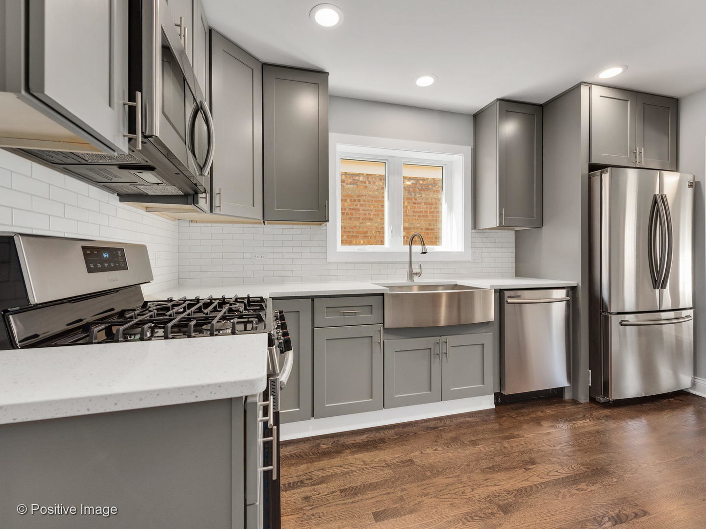 2232 Forest Avenue North Riverside, IL 60546 - Photo 5 of 17 a kitchen with a sink a refrigerator and cabinets