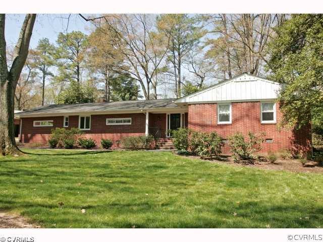 4544 Arrowhead Road Richmond, VA 23235 - Photo 1 of 12 a front view of a house with a garden