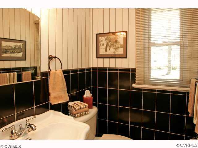 4544 Arrowhead Road Richmond, VA 23235 - Photo 8 of 12 a bathroom with a toilet a sink a window and shower
