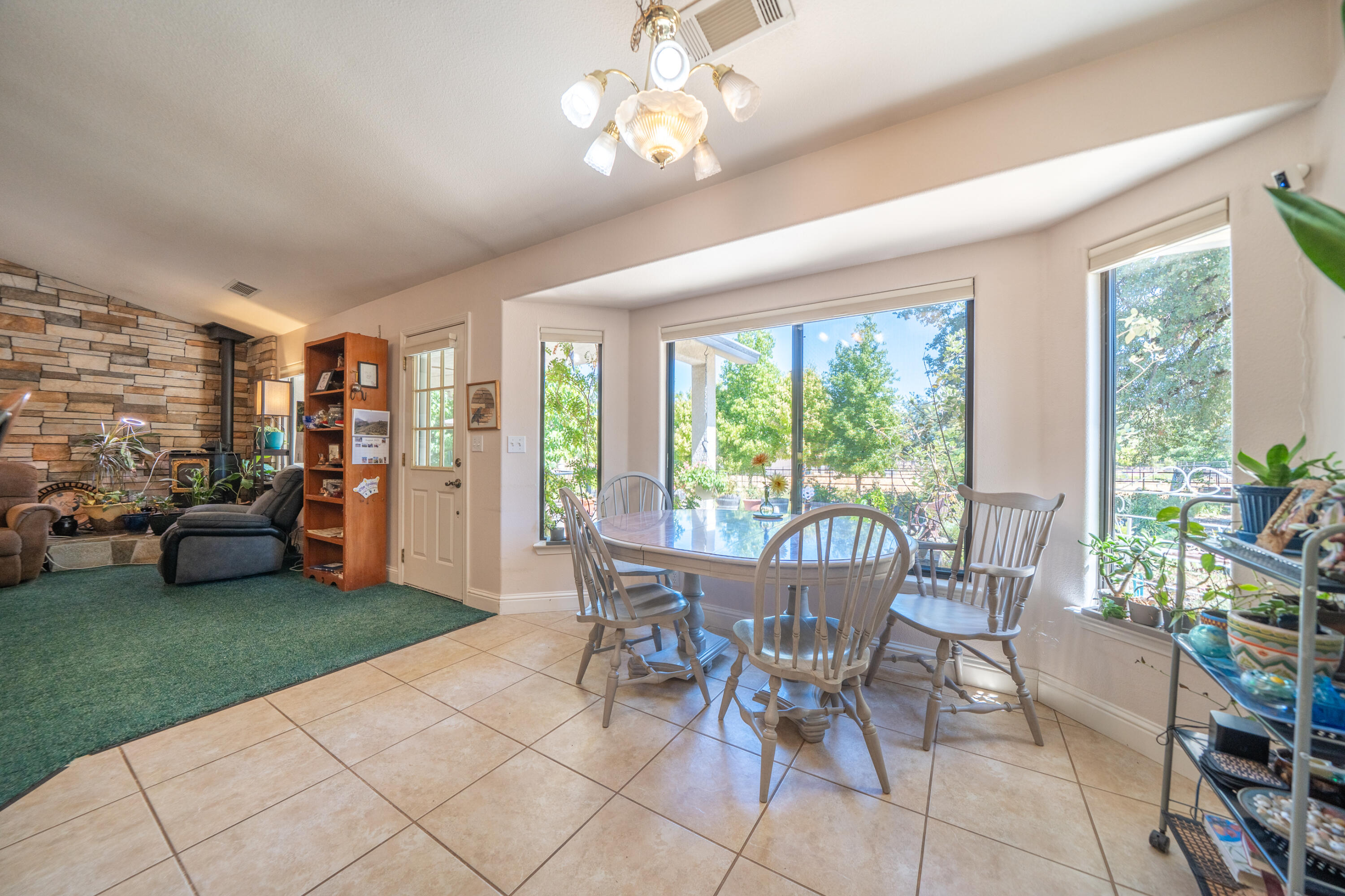 8533 Maynard Road Palo Cedro, CA 96073 - Photo 14 of 100 a view of a dining room with furniture window and outside view