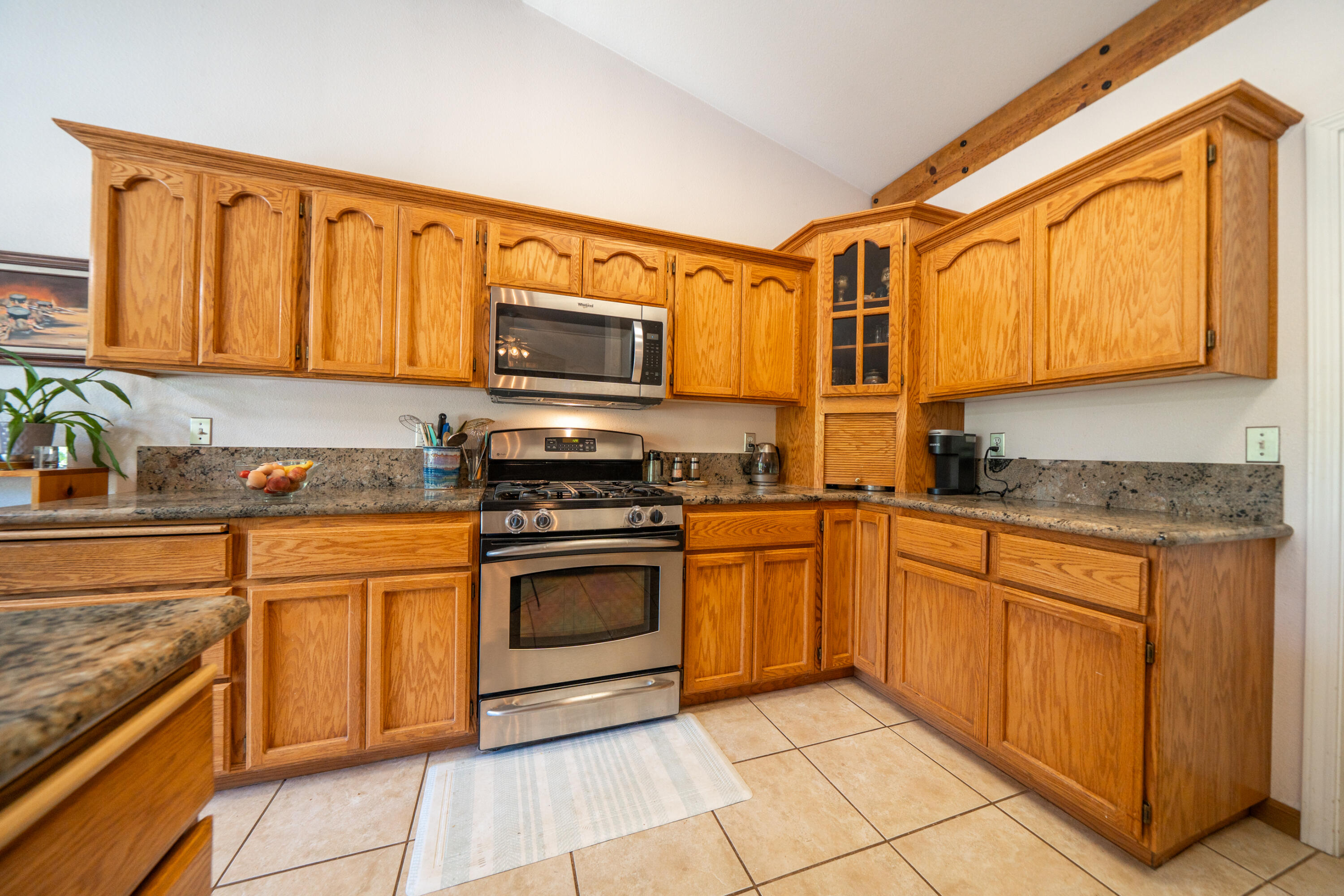 8533 Maynard Road Palo Cedro, CA 96073 - Photo 19 of 100 a kitchen with stainless steel appliances granite countertop wooden cabinets a stove top oven a sink and dishwasher