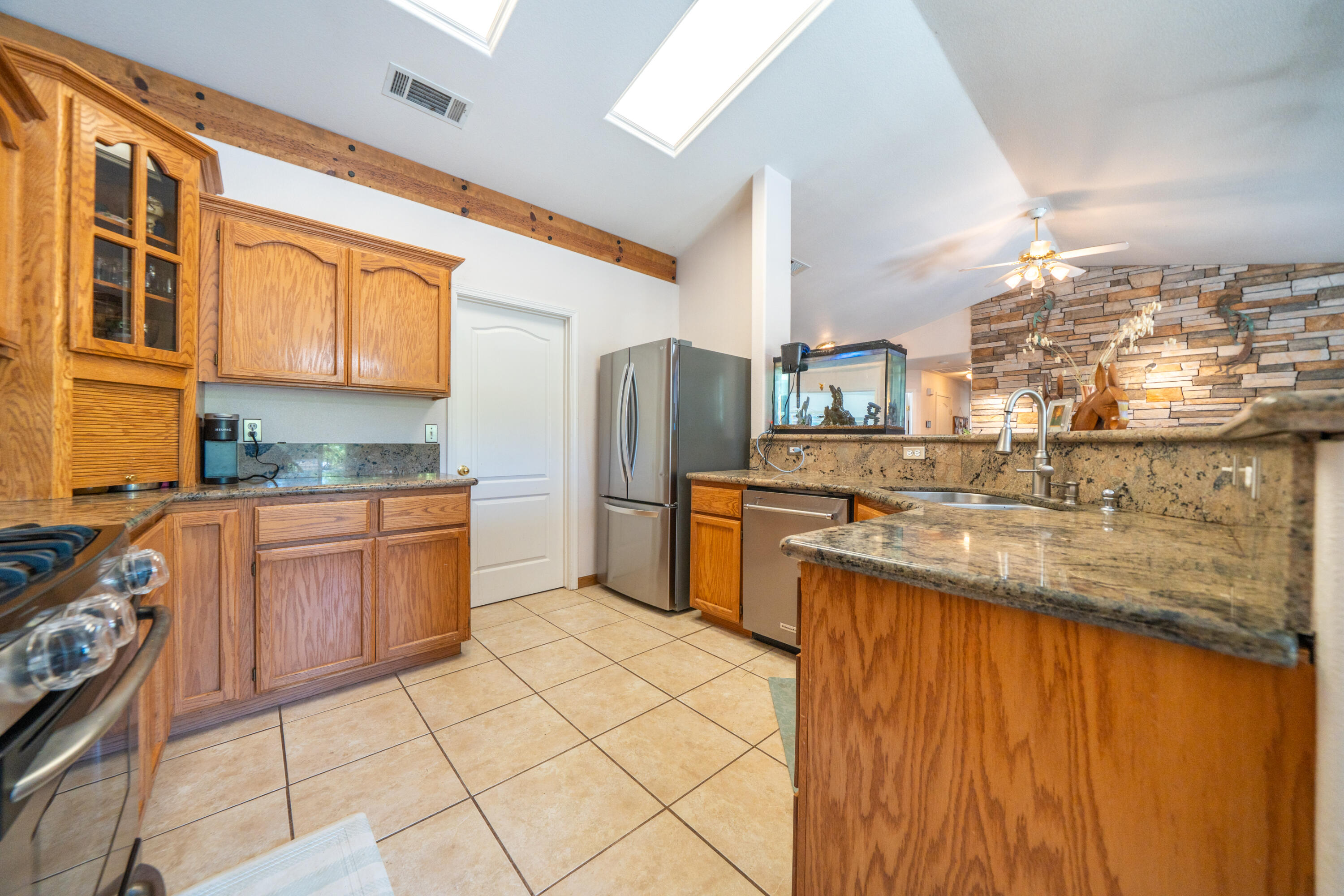 8533 Maynard Road Palo Cedro, CA 96073 - Photo 20 of 100 a kitchen with stainless steel appliances granite countertop a sink and cabinets