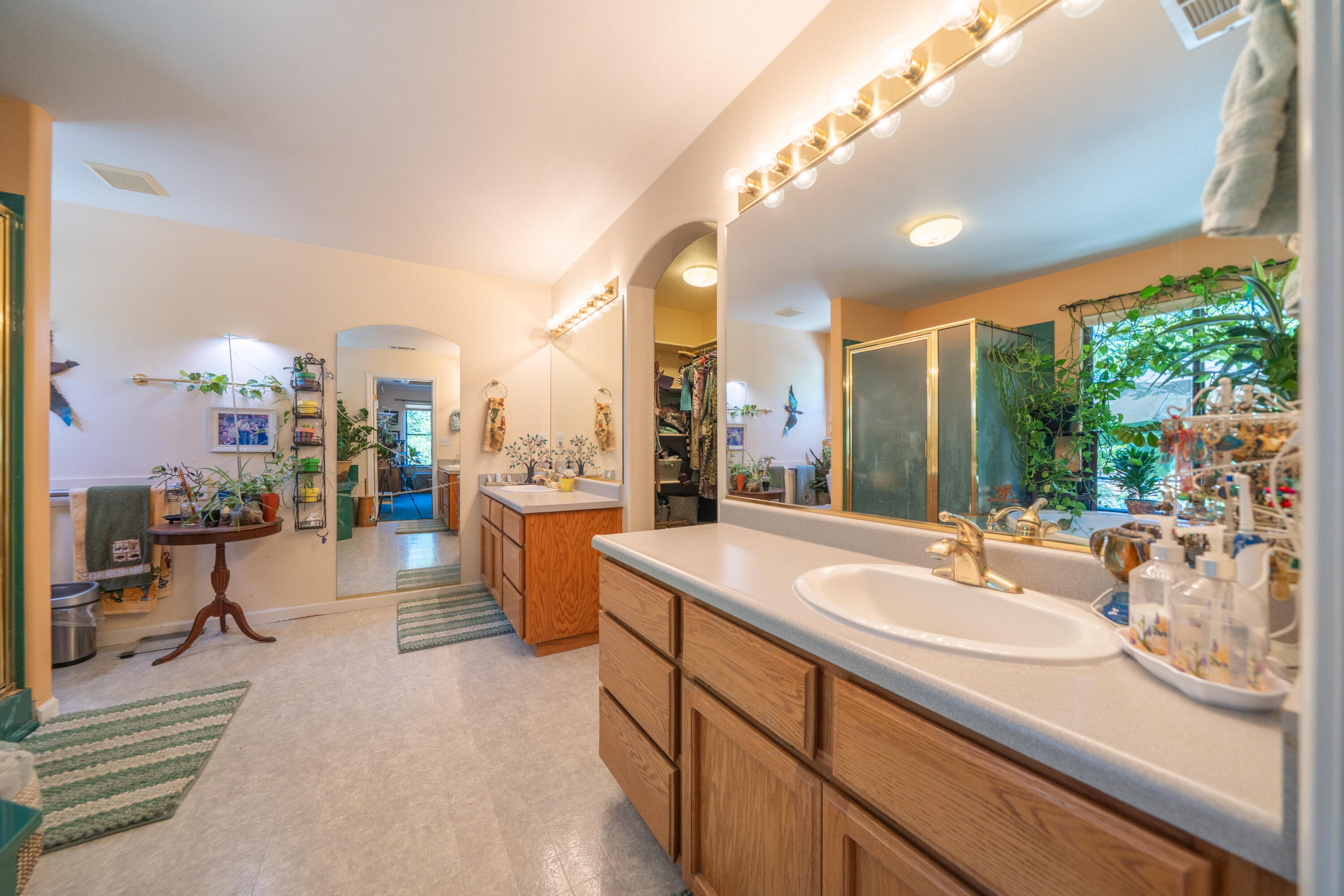8533 Maynard Road Palo Cedro, CA 96073 - Photo 23 of 100 a spacious bathroom with a sink and a large mirror