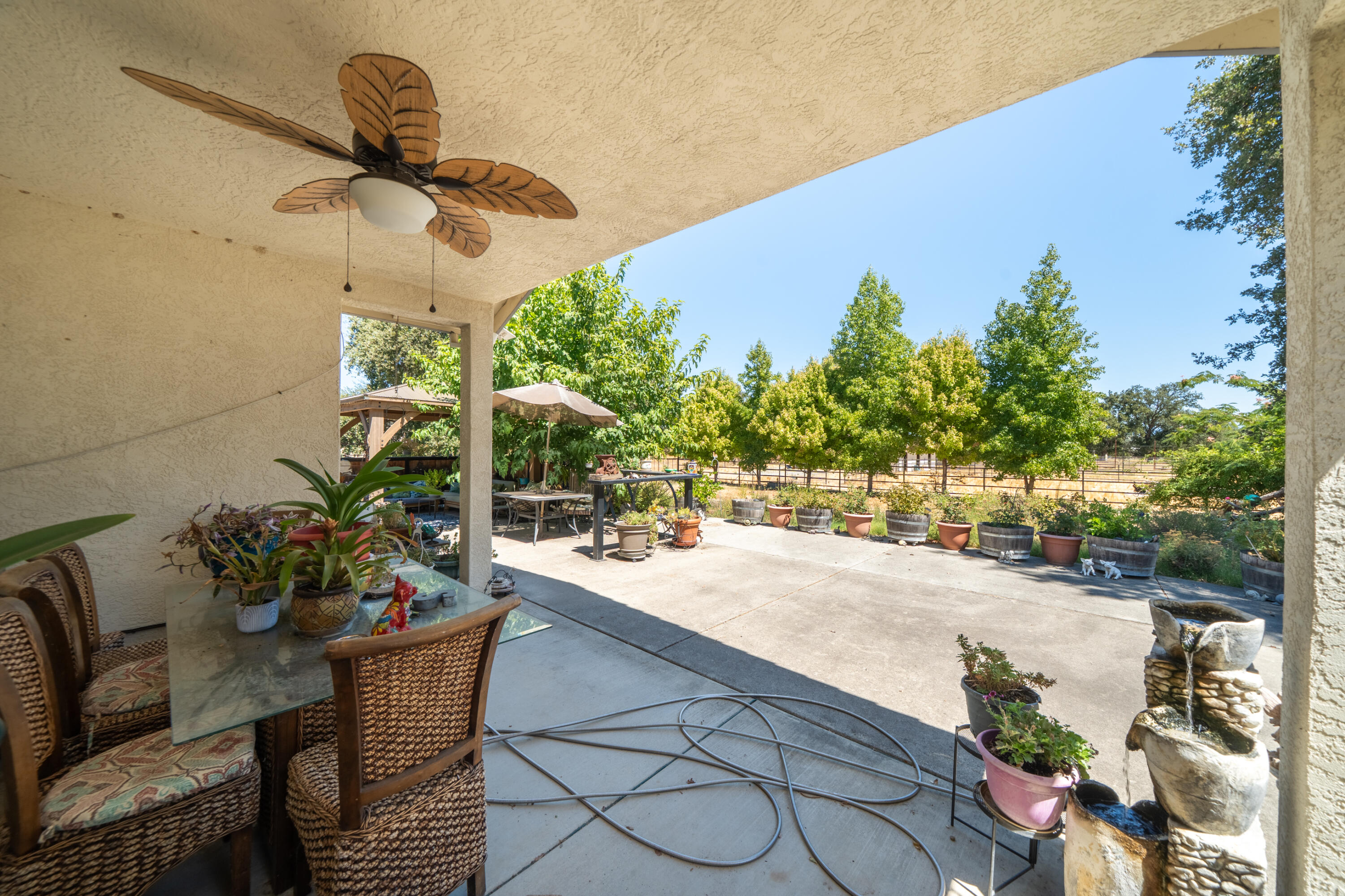8533 Maynard Road Palo Cedro, CA 96073 - Photo 36 of 100 a view of a patio with a dining table and chairs