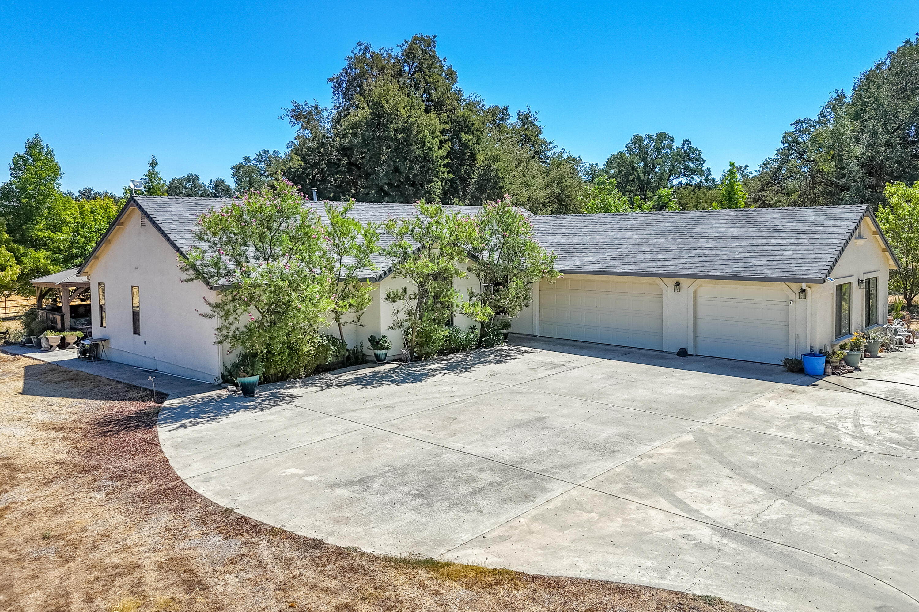 8533 Maynard Road Palo Cedro, CA 96073 - Photo 6 of 100 a view of a house with a yard and garage