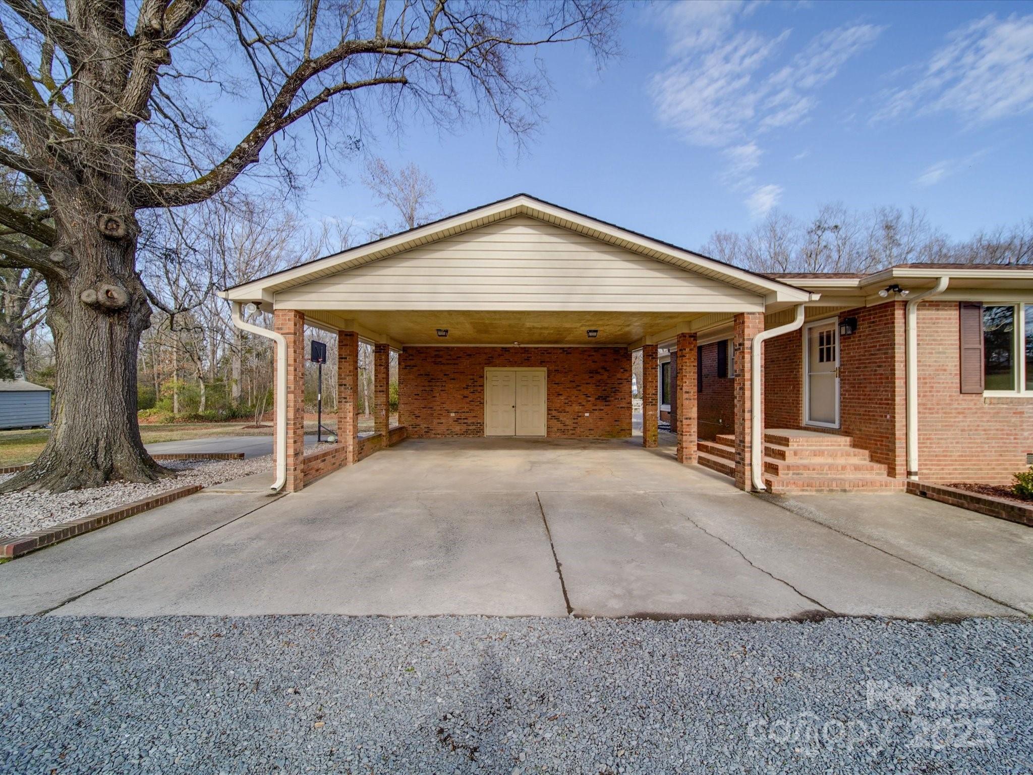 1515 Hasty Road Marshville, NC 28103 - Photo 13 of 40 a view of a house with basketball court