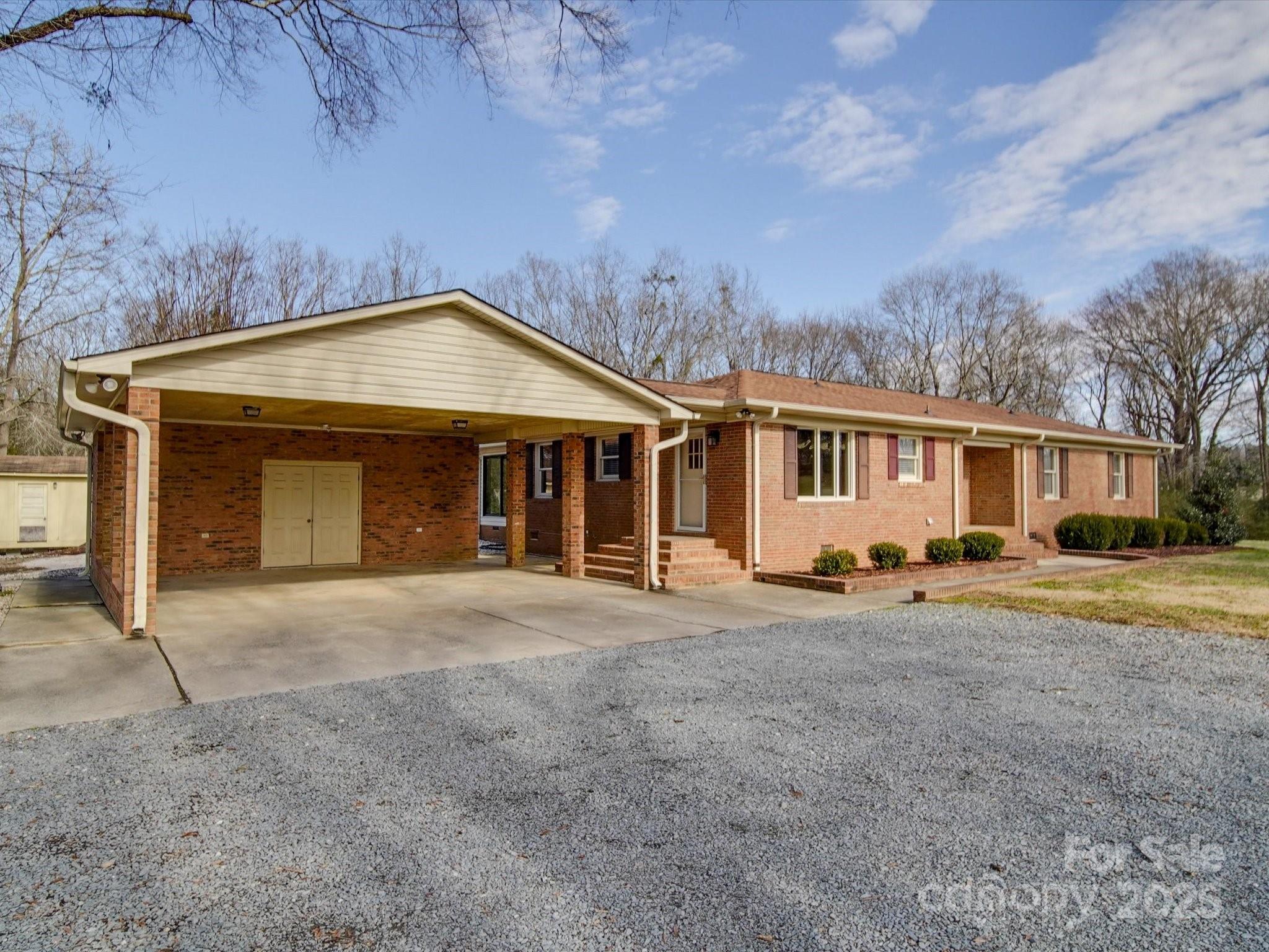 1515 Hasty Road Marshville, NC 28103 - Photo 15 of 40 a front view of a house with a yard and garage