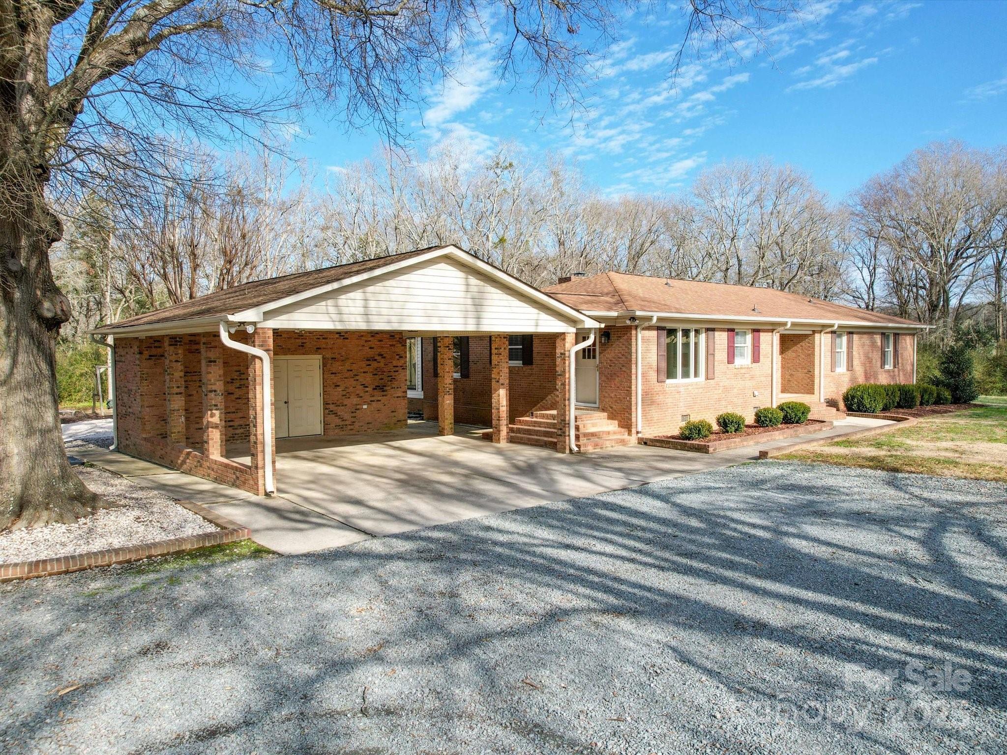 1515 Hasty Road Marshville, NC 28103 - Photo 2 of 40 a front view of a house with a yard and garage
