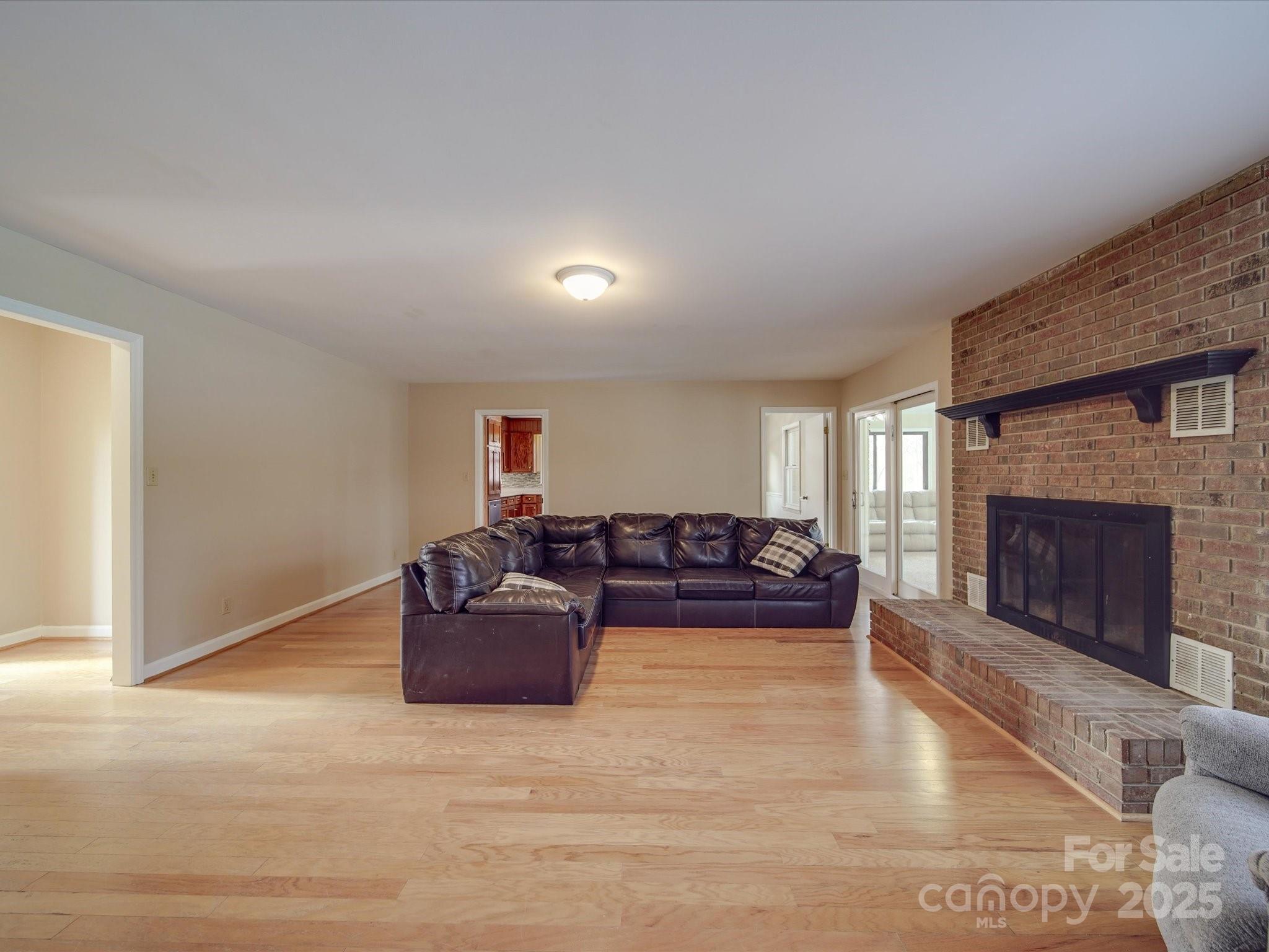 1515 Hasty Road Marshville, NC 28103 - Photo 21 of 40 a living room with furniture and a fireplace