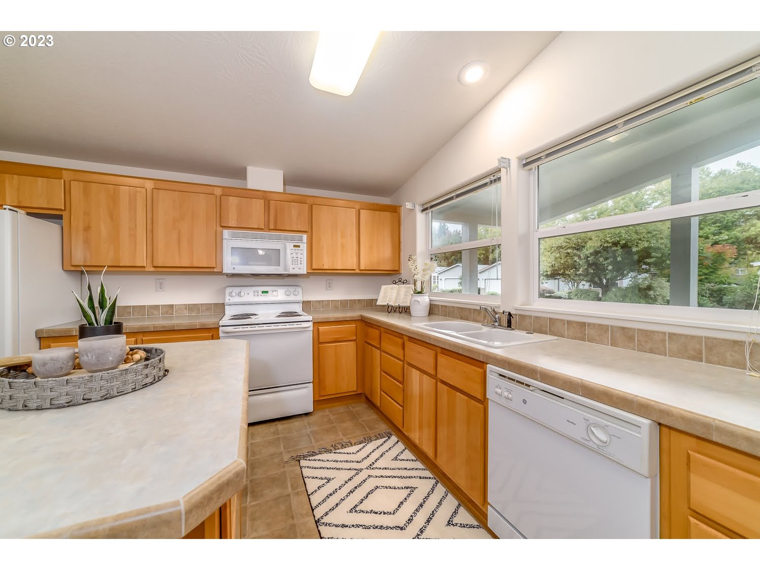 3220 Crescent Avenue, Unit 42 Eugene, OR 97408 - Photo 15 of 31 a kitchen with a sink cabinets and window