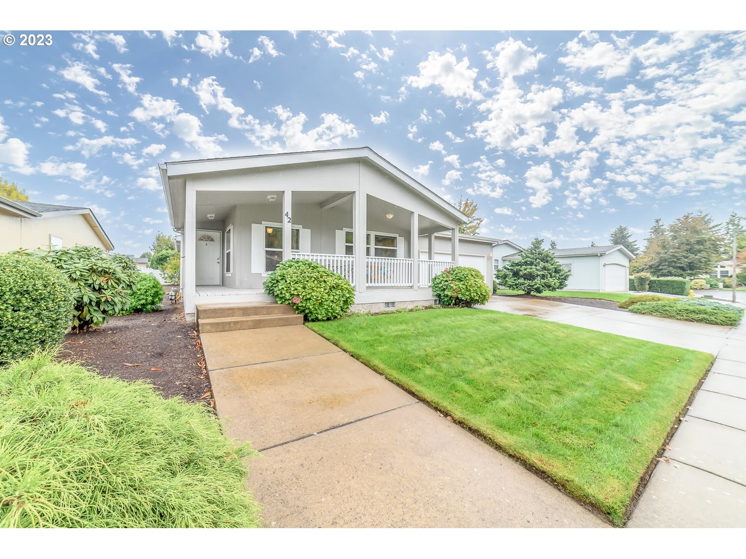 3220 Crescent Avenue, Unit 42 Eugene, OR 97408 - Photo 2 of 31 a front view of a house with garden