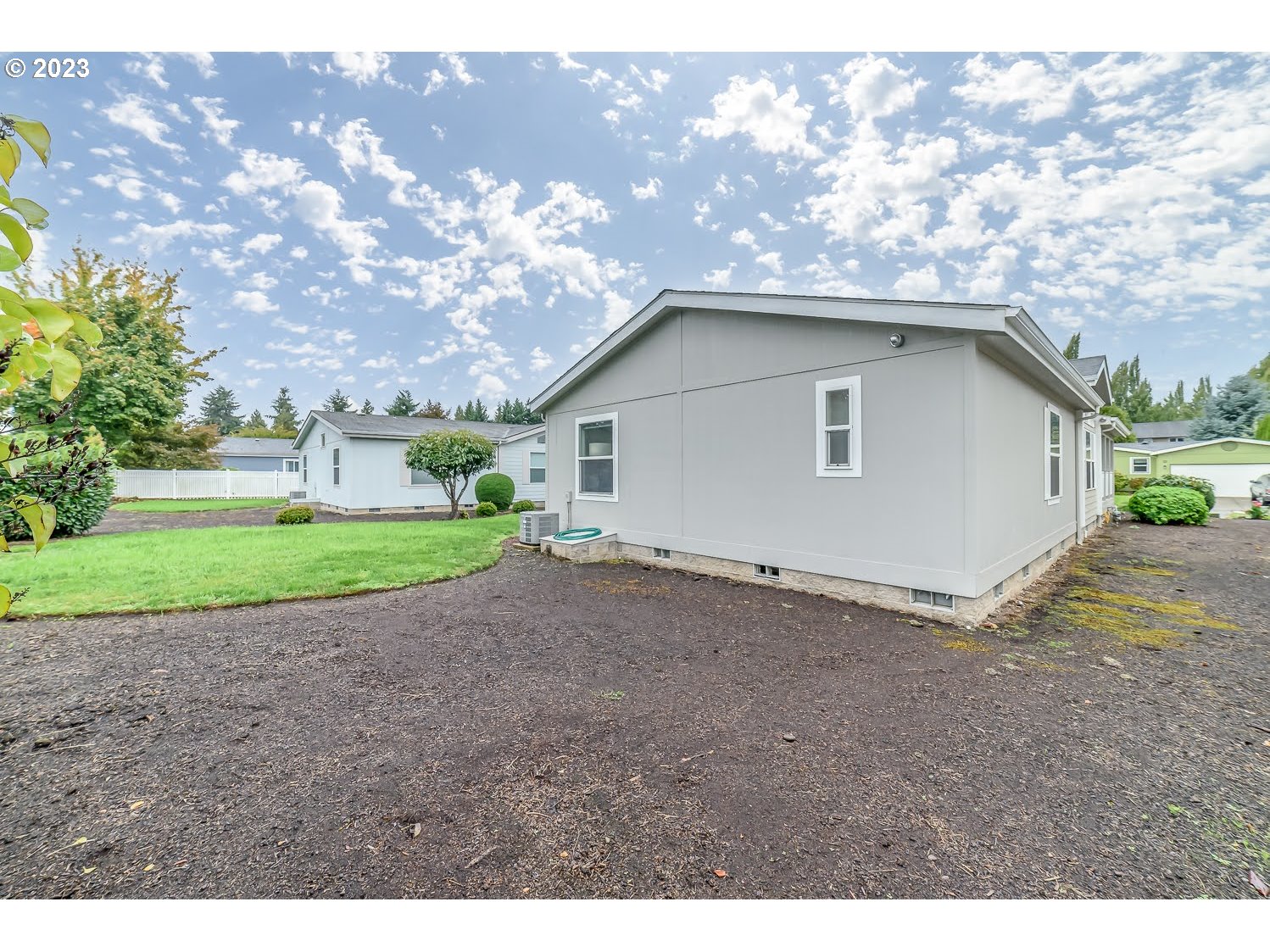 3220 Crescent Avenue, Unit 42 Eugene, OR 97408 - Photo 29 of 31 a view of a backyard with a large tree