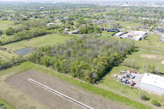 an aerial view of a golf course with parking space
