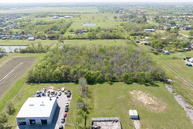an aerial view of a houses with outdoor space