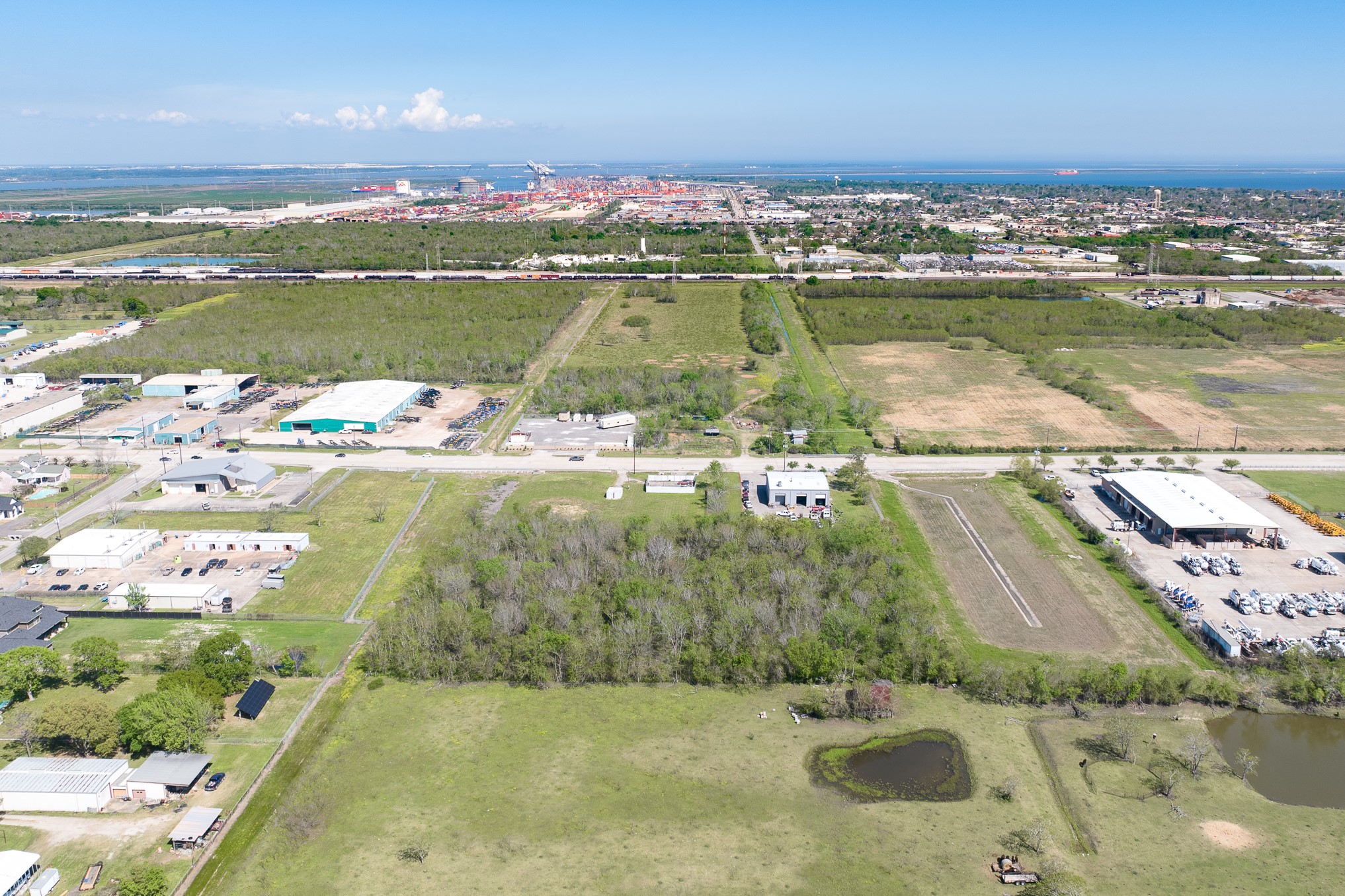 0 East H Street La Porte, TX 77571 - Photo 10 of 21 an aerial view of residential houses with outdoor space and lake view