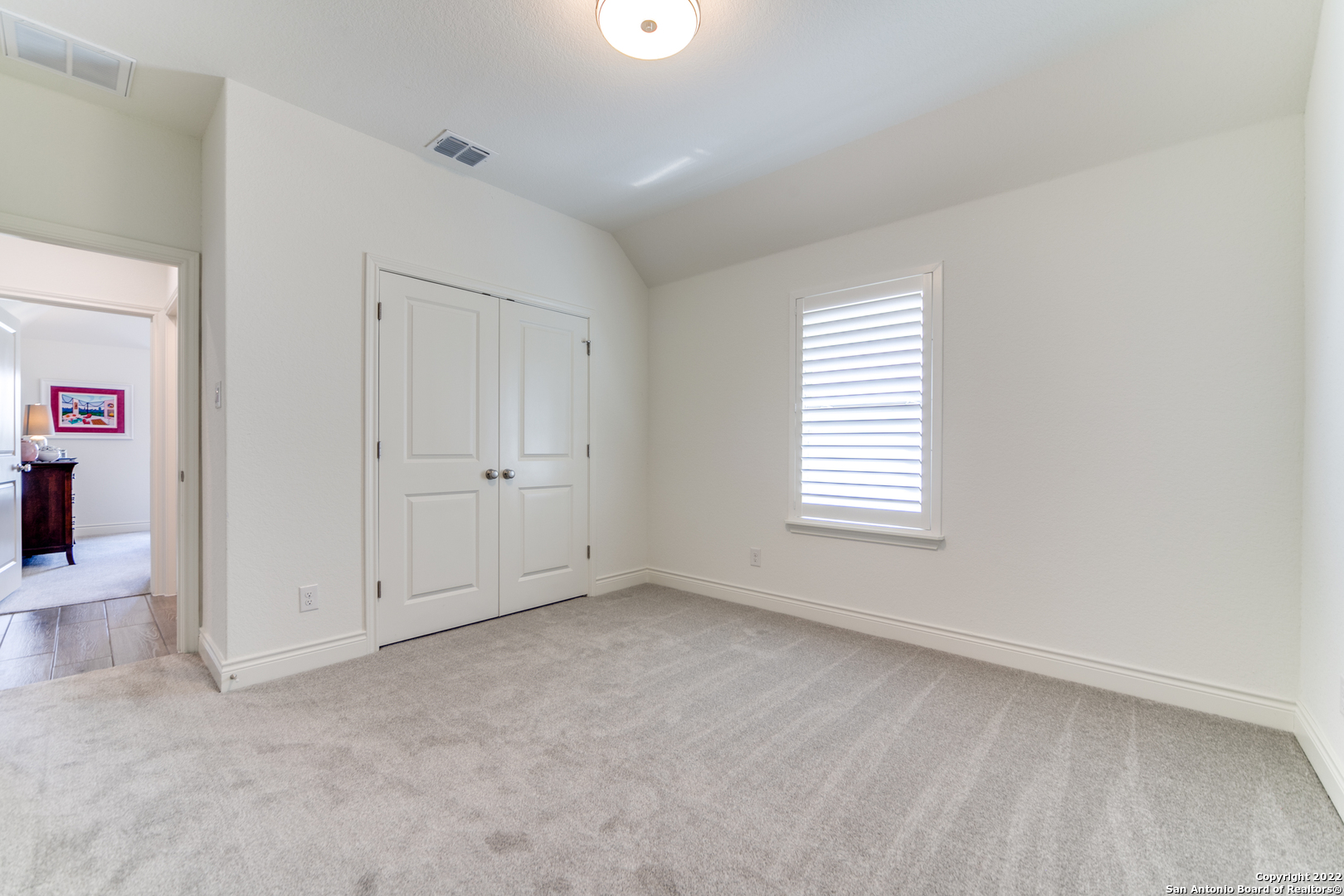 29734 Elkhorn Ridge Boerne, TX 78015 - Photo 20 of 25 an empty room with windows and closet