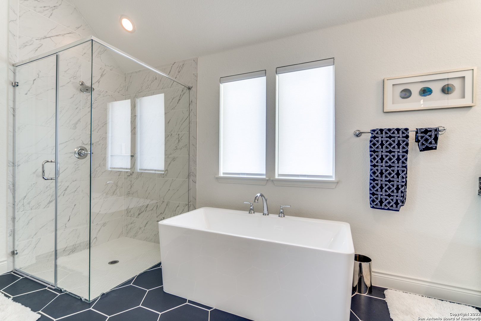 29734 Elkhorn Ridge Boerne, TX 78015 - Photo 21 of 25 a bathroom with a shower and a sink