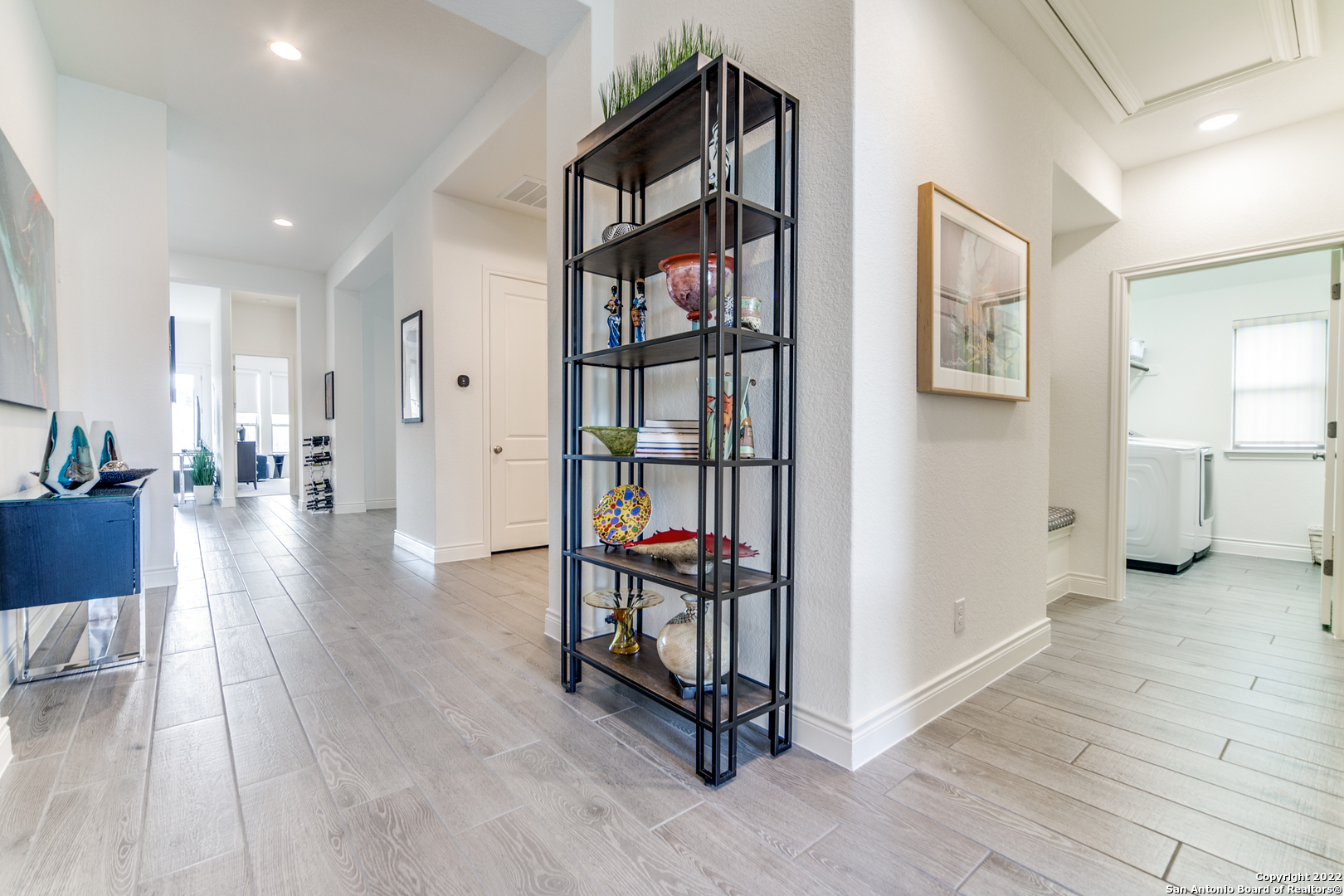 29734 Elkhorn Ridge Boerne, TX 78015 - Photo 3 of 25 a view of a hallway with wooden floor and windows