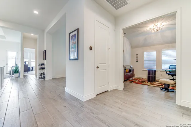 a view of a livingroom with furniture and hardwood floor