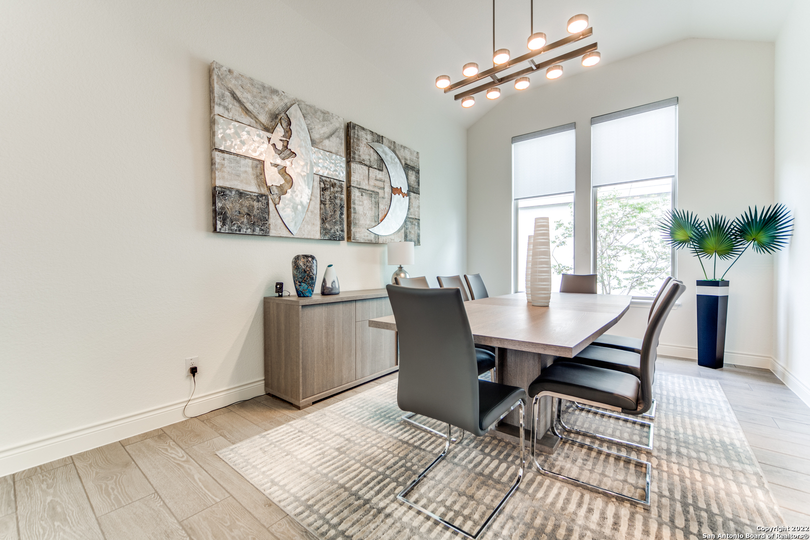 29734 Elkhorn Ridge Boerne, TX 78015 - Photo 7 of 25 a view of a dining room with furniture and a chandelier