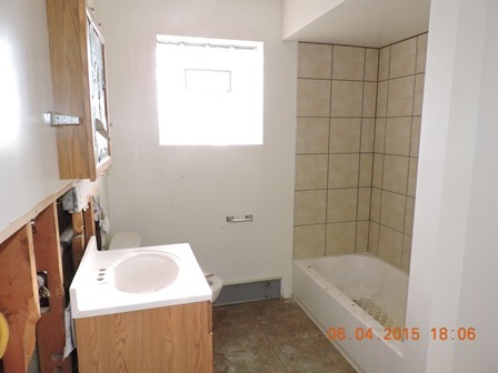 912 Madison Street Maywood, IL 60153 - Photo 20 of 23 a bathroom with a sink a bath tub and a shower