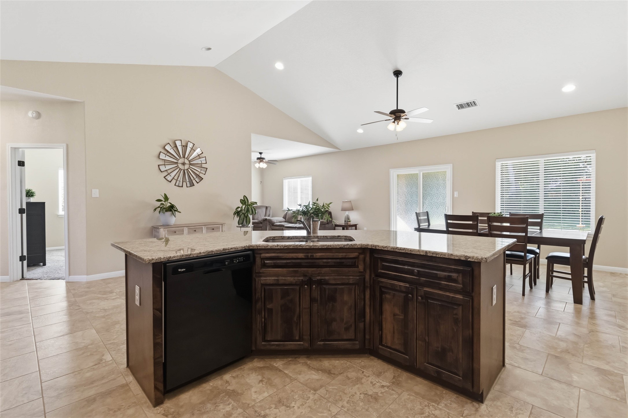 285 Hummingbird Way Martindale, TX 78655 - Photo 5 of 40 a kitchen with a sink and chairs