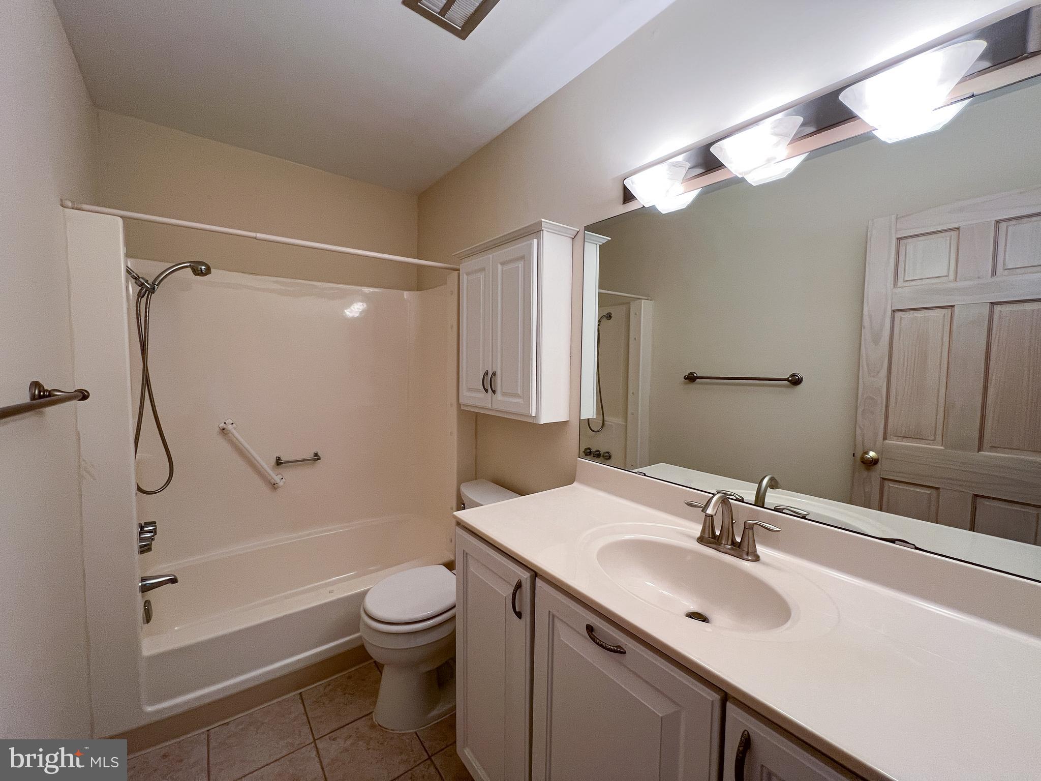 3163 Adderley Court Silver Spring, MD 20906 - Photo 18 of 26 a bathroom with a sink toilet tub and shower