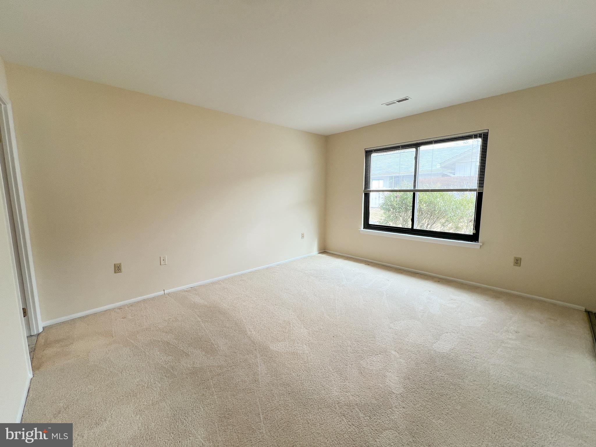 3163 Adderley Court Silver Spring, MD 20906 - Photo 24 of 26 an empty room with windows and closet