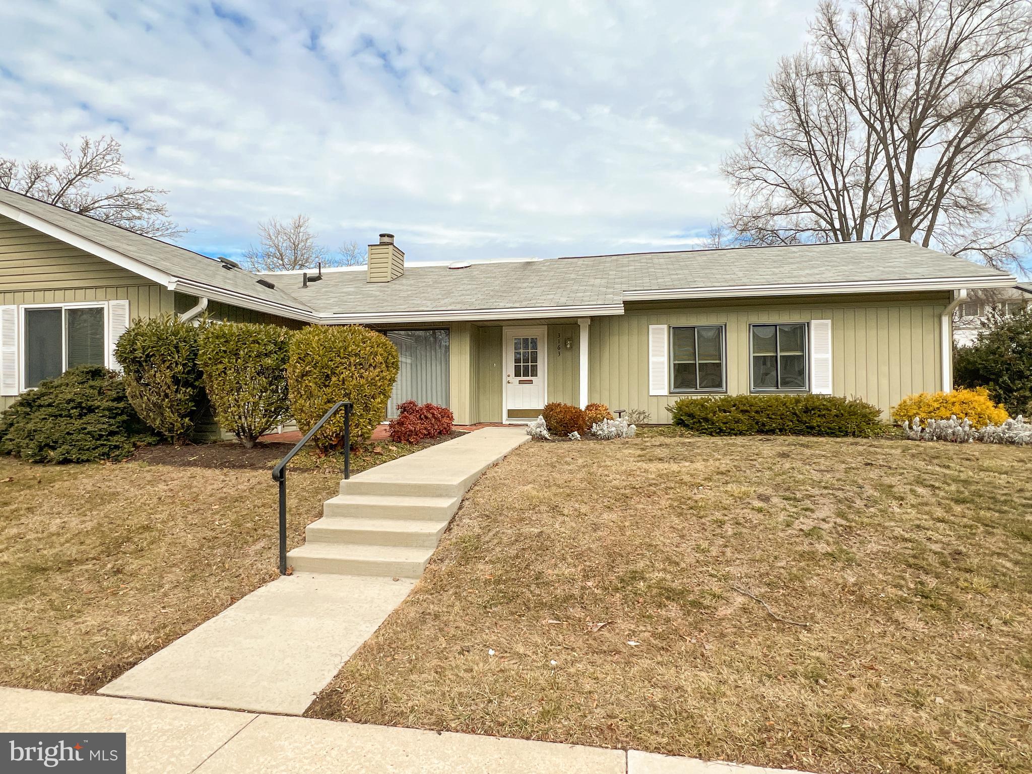 3163 Adderley Court Silver Spring, MD 20906 - Photo 3 of 26 a front view of a house with garden