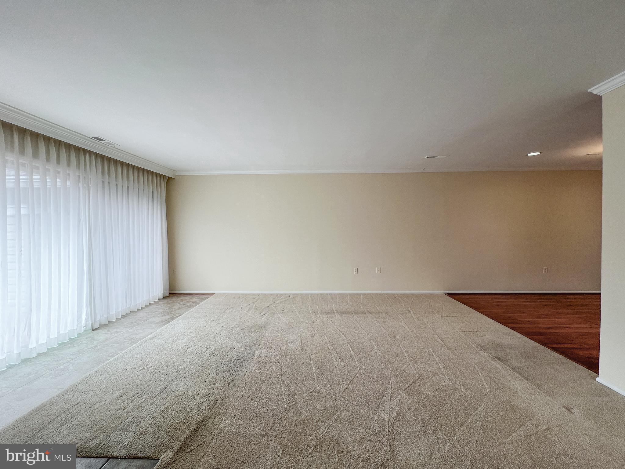 3163 Adderley Court Silver Spring, MD 20906 - Photo 7 of 26 an empty room with a bench