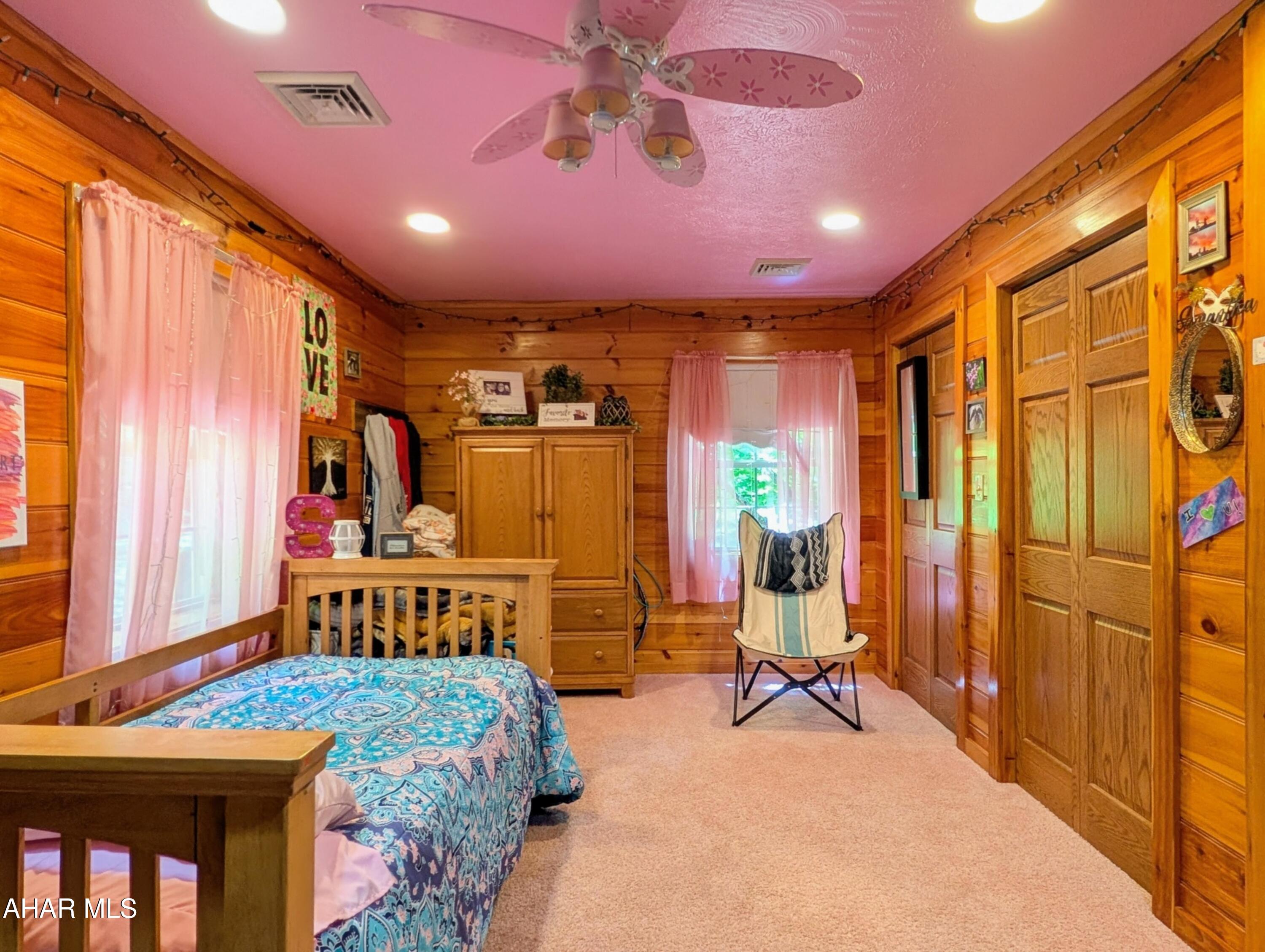 213 Sherman Valley Road Hopewell, PA 16650 - Photo 49 of 104 a bedroom with furniture and a flat screen tv