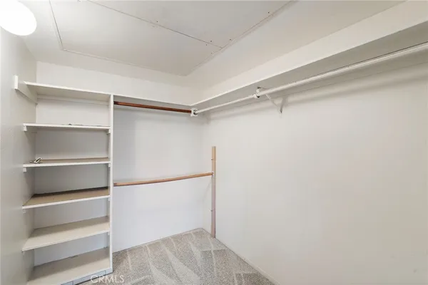 a view of an empty walk in closet
