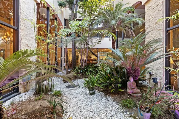a view of a room with lots of table and chairs