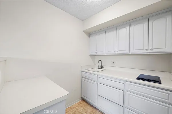 a kitchen with a sink and cabinets