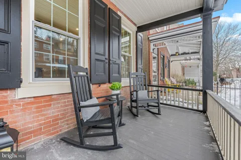 a view of living room with balcony and furniture