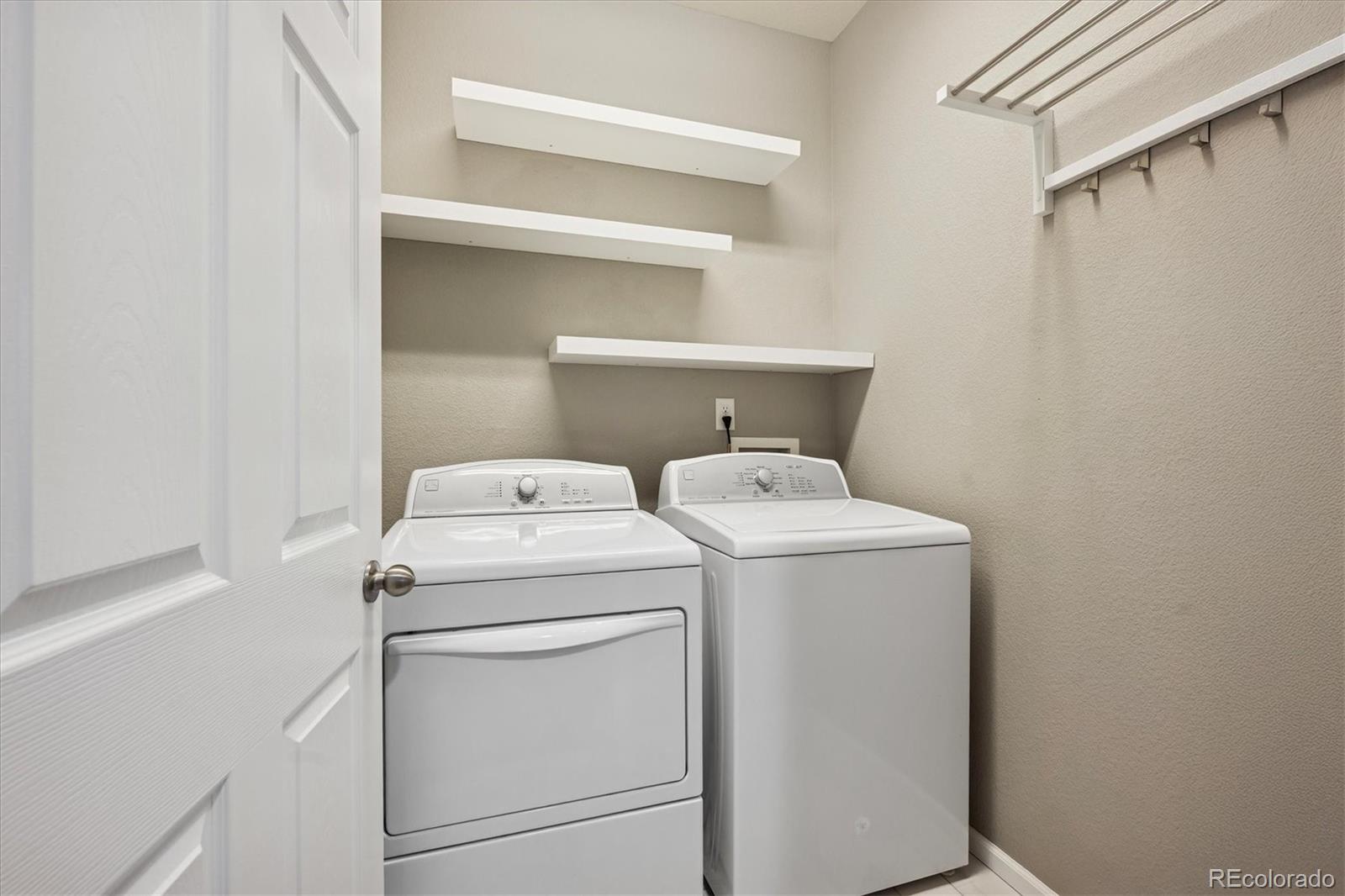 3350 Cascina Circle, Unit D Highlands Ranch, CO 80126 - Photo 18 of 40 a utility room with dryer and washer