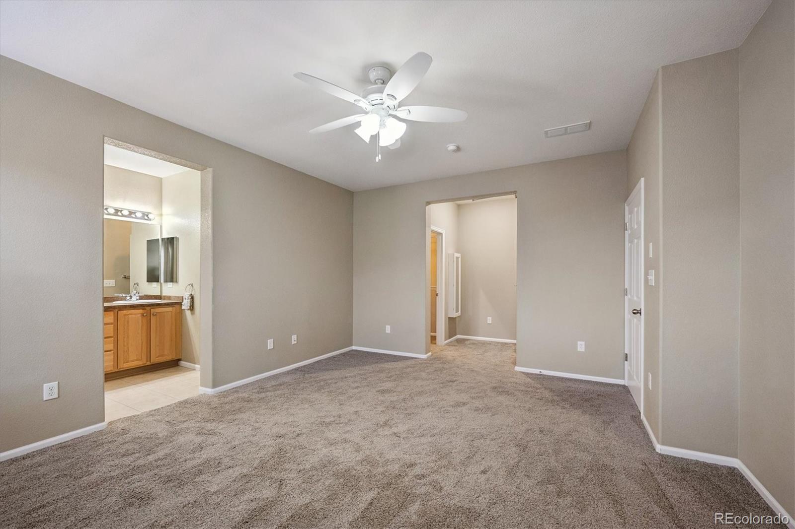 3350 Cascina Circle, Unit D Highlands Ranch, CO 80126 - Photo 21 of 40 a view of an empty room with closet and a window