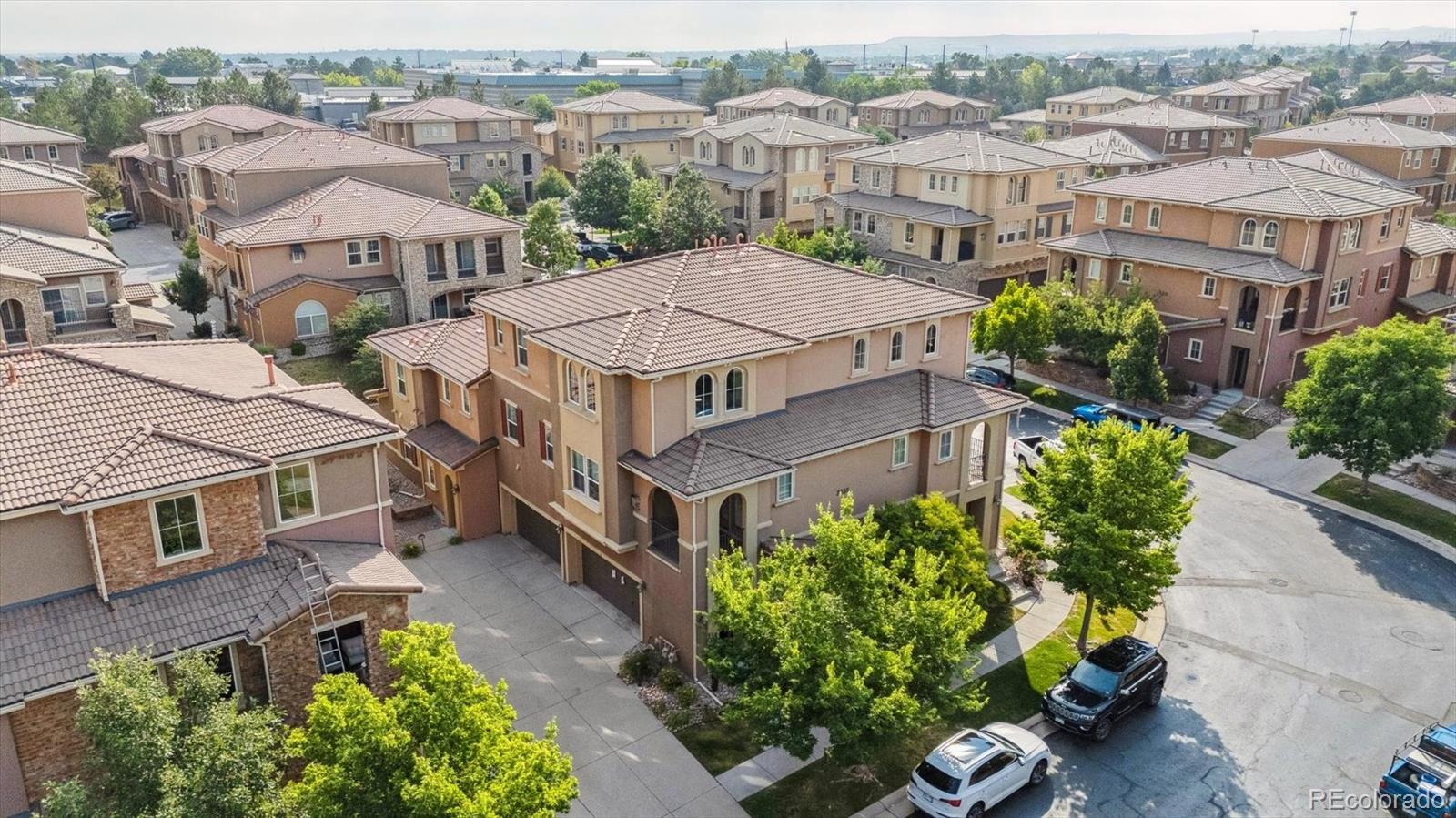 3350 Cascina Circle, Unit D Highlands Ranch, CO 80126 - Photo 27 of 40 an aerial view of multiple houses with a yard