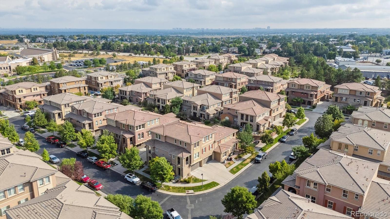 3350 Cascina Circle, Unit D Highlands Ranch, CO 80126 - Photo 28 of 40 an aerial view of a city with lots of residential buildings