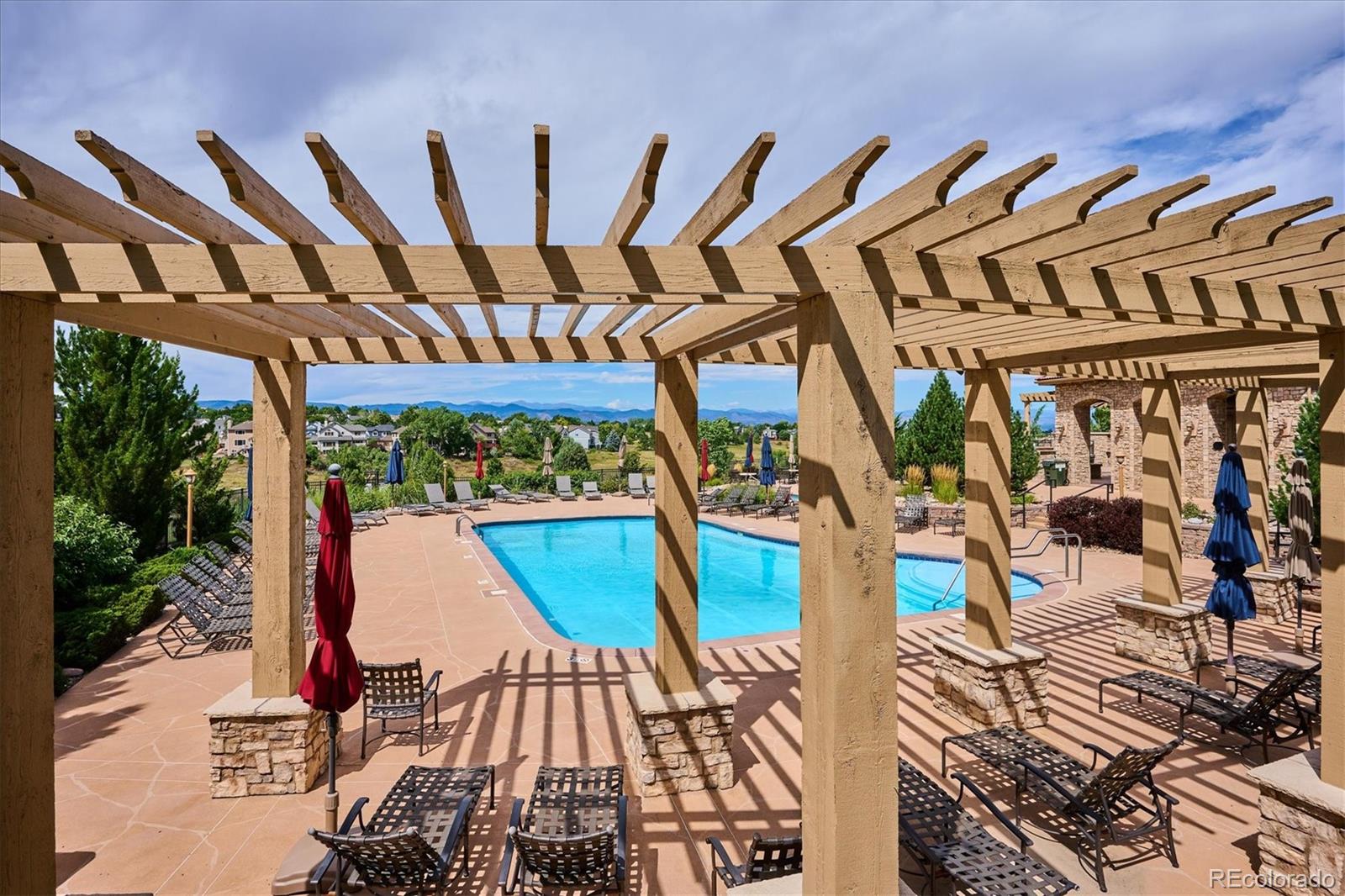 3350 Cascina Circle, Unit D Highlands Ranch, CO 80126 - Photo 37 of 40 a view of a swimming pool with sitting area