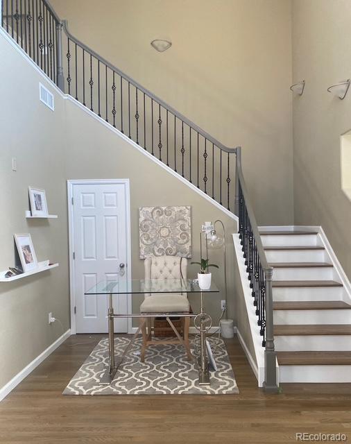 3350 Cascina Circle, Unit D Highlands Ranch, CO 80126 - Photo 6 of 40 a living room with stairs
