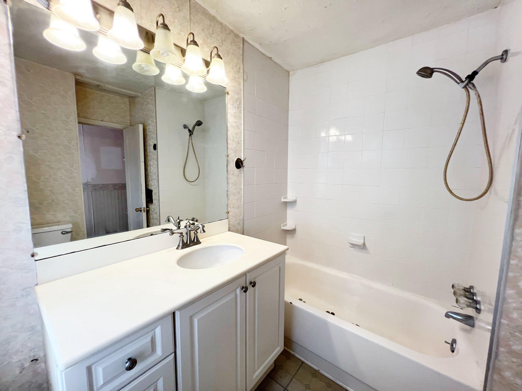 1545 Almshouse Road Jamison, PA 18929 - Photo 23 of 30 a bathroom with a sink vanity mirror and a bathtub